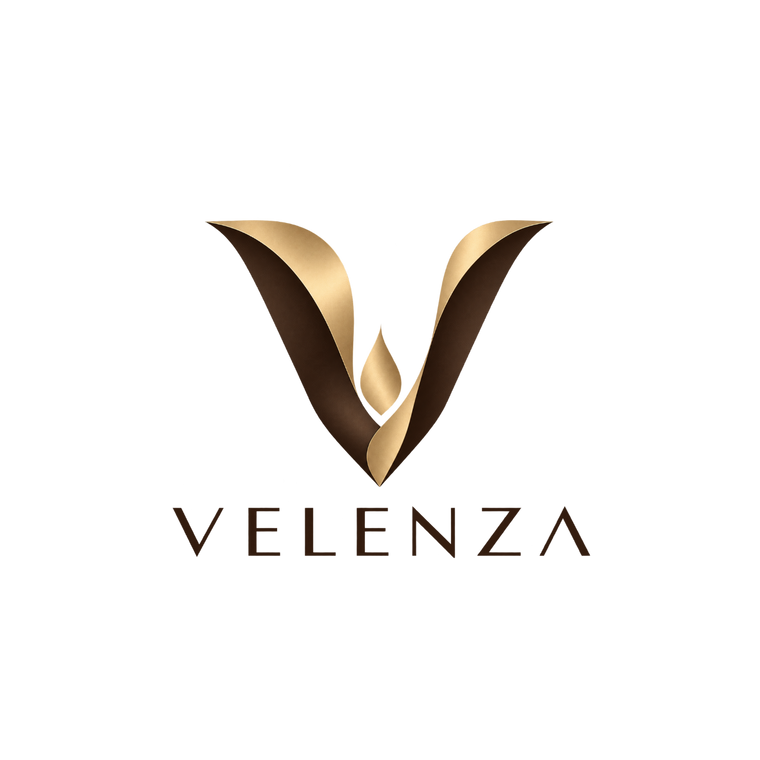The Velenza brand logo, featuring a stylized metallic gold and dark brown 'V' emblem with a central teardrop motif, above the brand name 'VELENZA' in dark brown serif lettering, all set against a solid white background.